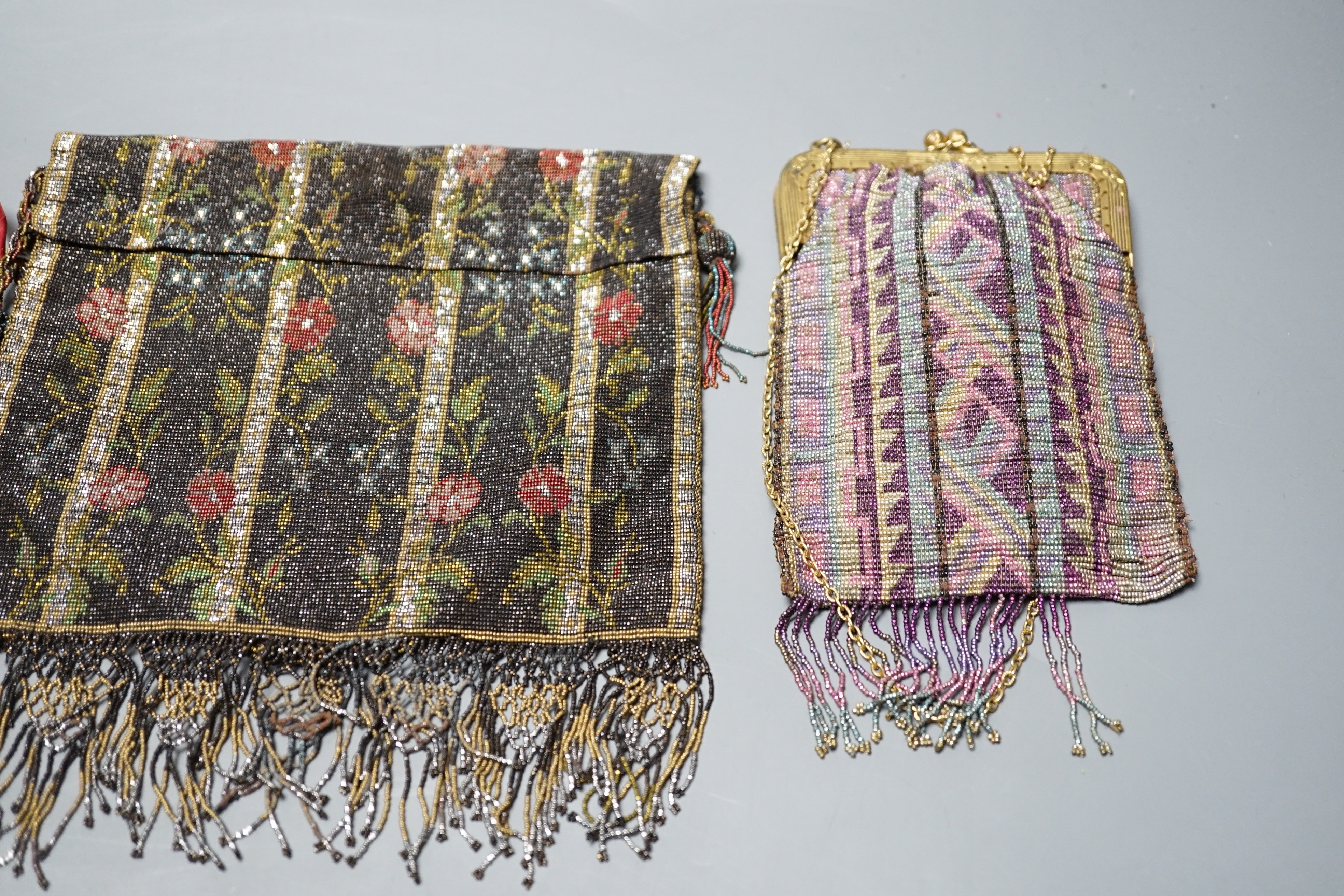 Three finely worked cut steel bags, circa 1920, possibly French, two worked into multicoloured abstract designs and the other as floral design, floral bag 16 cms x 19 cms